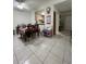 Open concept dining area with views into the kitchen at 2765 Montego Bay Blvd, Kissimmee, FL 34746