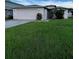 Charming single-story home featuring a well-maintained front yard and a two-car garage at 2765 Montego Bay Blvd, Kissimmee, FL 34746