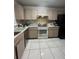 Well-lit kitchen featuring ample cabinet space, and a black refrigerator at 2765 Montego Bay Blvd, Kissimmee, FL 34746