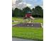 Community playground with play structure, climbing dome, and mature trees at 2765 Montego Bay Blvd, Kissimmee, FL 34746