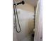 Clean shower with adjustable shower head and white tile at 2765 Montego Bay Blvd, Kissimmee, FL 34746