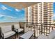 Relaxing balcony with comfortable seating offers partial ocean and building views at 2947 S Atlantic Ave # 601, Daytona Beach, FL 32118