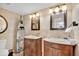 Charming bathroom featuring a dual sink vanity with elegant fixtures and a decorative boat shelf at 2947 S Atlantic Ave # 601, Daytona Beach, FL 32118