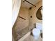 Modern shower room with tile floor, rain shower head, grab bar and updated fixtures at 2947 S Atlantic Ave # 601, Daytona Beach, FL 32118