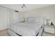 Well-lit bedroom with neutral tones, a plush bed, and a pair of mirrored bedside tables at 2947 S Atlantic Ave # 601, Daytona Beach, FL 32118