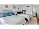 Well-lit bedroom with two beds, neutral decor, and a mirrored closet, providing a relaxing space at 2947 S Atlantic Ave # 601, Daytona Beach, FL 32118