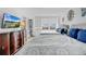 Bright bedroom featuring two beds, beach view from the window, and a dresser with a TV at 2947 S Atlantic Ave # 601, Daytona Beach, FL 32118