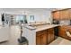 Beautiful kitchen features a breakfast bar, granite counters, and plenty of storage space at 2947 S Atlantic Ave # 601, Daytona Beach, FL 32118