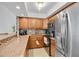 Well-equipped kitchen features stainless steel appliances, tiled backsplash and plenty of counter space at 2947 S Atlantic Ave # 601, Daytona Beach, FL 32118