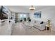 Bright living room with a comfortable sofa, stylish decor, and a beautiful balcony at 2947 S Atlantic Ave # 601, Daytona Beach, FL 32118