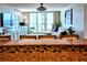 View from the kitchen into the beautifully decorated living room with access to a large balcony at 2947 S Atlantic Ave # 601, Daytona Beach, FL 32118