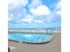 Oceanfront pool with chairs and tables for residents at 2947 S Atlantic Ave # 601, Daytona Beach, FL 32118