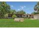 Expansive backyard featuring a screened-in porch and ample green space perfect for outdoor activities at 2990 E Central Ave, Bartow, FL 33830