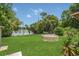Expansive backyard near lake with mature trees and lush landscaping at 2990 E Central Ave, Bartow, FL 33830