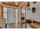 Inviting foyer featuring tile floors, wood ceiling and trim, and a front door with side windows at 2990 E Central Ave, Bartow, FL 33830