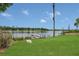 Scenic lake view with a wooden dock, perfect for waterfront living at 2990 E Central Ave, Bartow, FL 33830