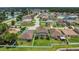 Aerial view of the house featuring a well-maintained lawn and fenced backyard in a serene neighborhood at 3009 Park Ridge Ave, Mulberry, FL 33860