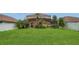 Large backyard with a well-kept lawn and privacy fence at 3009 Park Ridge Ave, Mulberry, FL 33860