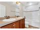 Bathroom with double sink vanity, and shower and tub combo at 3009 Park Ridge Ave, Mulberry, FL 33860