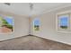 Well-lit bedroom featuring neutral walls, carpeted floor and large windows at 3009 Park Ridge Ave, Mulberry, FL 33860