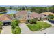Two-story home boasts well-manicured landscaping and a paved driveway leading to an attached garage at 3009 Park Ridge Ave, Mulberry, FL 33860