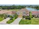 Beautiful home with lush landscaping, a paved driveway, and an attached garage for convenience at 3009 Park Ridge Ave, Mulberry, FL 33860