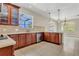 Spacious kitchen featuring a peninsula with bar seating and a view into the dining room at 3009 Park Ridge Ave, Mulberry, FL 33860