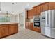 Modern kitchen with stainless steel refrigerator and built-in microwave at 3009 Park Ridge Ave, Mulberry, FL 33860