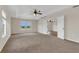 Large main bedroom with trey ceiling, a ceiling fan and doorway to additional space at 3009 Park Ridge Ave, Mulberry, FL 33860