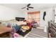 Bedroom with ceiling fan, dresser with mirror, and ample natural light at 3280 Pinto Dr, Kissimmee, FL 34746