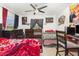 Bedroom with lots of wall decor, tile floors, and natural light from the window at 3280 Pinto Dr, Kissimmee, FL 34746