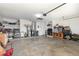 Attached garage featuring laundry hookups, shelving, and storage space at 3280 Pinto Dr, Kissimmee, FL 34746