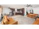 Open living space with adjacent kitchen featuring tile floors and natural light throughout at 3280 Pinto Dr, Kissimmee, FL 34746