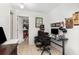 Office space featuring tile flooring, desk, chair, and view into the bedroom at 3280 Pinto Dr, Kissimmee, FL 34746