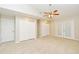 Spacious bedroom with double closets, ceiling fan and exterior door at 33042 Lake Bend Cir, Leesburg, FL 34788