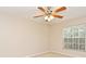 Bedroom features ceiling fan, closet and a window that provides natural light at 33042 Lake Bend Cir, Leesburg, FL 34788