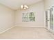 Dining room featuring vaulted ceiling, and access to the patio at 33042 Lake Bend Cir, Leesburg, FL 34788