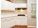 Bright kitchen with white cabinets, light countertop, and a gas stovetop at 33042 Lake Bend Cir, Leesburg, FL 34788