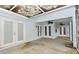 Covered patio features two ceiling fans and exterior doors to the backyard at 33042 Lake Bend Cir, Leesburg, FL 34788