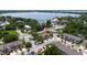 Aerial community view with lush landscapes, manicured lawns, and lake nearby at 3508 Brighton Park Cir, Belle Isle, FL 32812