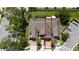 Aerial view highlighting unit proximity within community, driveway pavers, and lush landscaping at 3508 Brighton Park Cir, Belle Isle, FL 32812