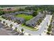 Aerial view of neighborhood featuring manicured lawns, sidewalks, and lush green spaces at 3508 Brighton Park Cir, Belle Isle, FL 32812