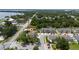 Overhead neighborhood view showcases lush landscapes, sidewalks, lake, and manicured lawns at 3508 Brighton Park Cir, Belle Isle, FL 32812
