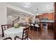 Open-concept kitchen with dark cabinets, stainless steel appliances, and a large island at 3508 Brighton Park Cir, Belle Isle, FL 32812
