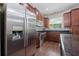 Well-equipped kitchen with stainless steel appliances, granite countertops, and dark cabinetry at 3508 Brighton Park Cir, Belle Isle, FL 32812