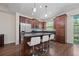 Spacious kitchen featuring an island with bar seating, stainless steel appliances, and wood flooring at 3508 Brighton Park Cir, Belle Isle, FL 32812