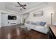 Cozy living room with hardwood floors, modern decor, and ample natural light at 3508 Brighton Park Cir, Belle Isle, FL 32812