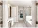 Open bathroom with a double vanity, walk-in shower, and soaking tub, offering a spa-like experience at 351 S Sunset Ave, Mascotte, FL 34753