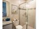 Stylish bathroom featuring granite countertops, a glass-enclosed shower, and tile accents at 351 S Sunset Ave, Mascotte, FL 34753
