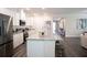 Stylish kitchen boasting stainless steel appliances, granite counters, and hardwood floors at 351 S Sunset Ave, Mascotte, FL 34753